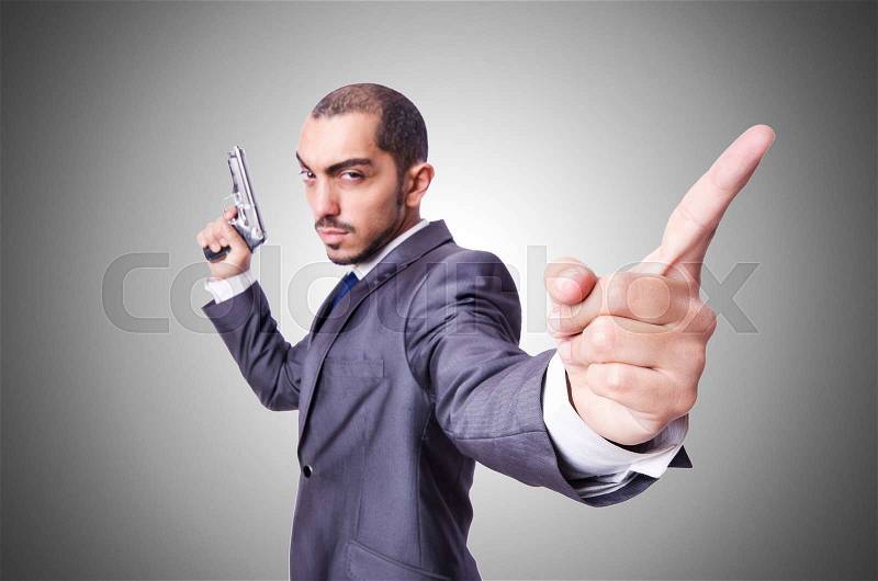Businessman with gun isolated on white, stock photo