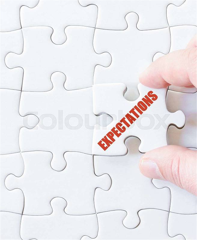 Last puzzle piece with word EXPECTATIONS. Concept image, stock photo
