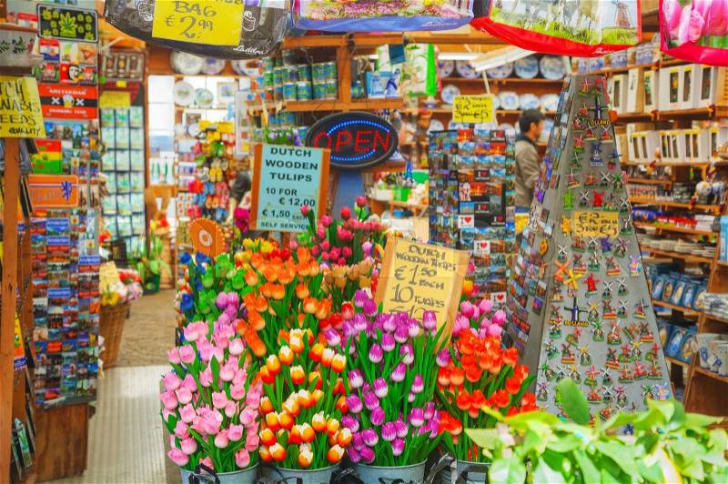 AMSTERDAM - APRIL 17: Souvenir shop at the floating flower market on April 17, 2015 in Amsterdam, Netherlands. It’s usually billed as the “world’s only floating flower market”, stock photo