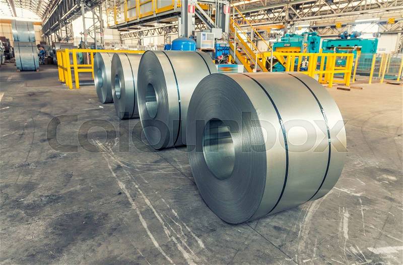 Steel coils inside industrial shed, stock photo