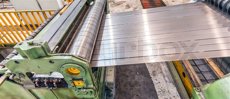 Steel coil cut machine. Industrial environment, stock photo