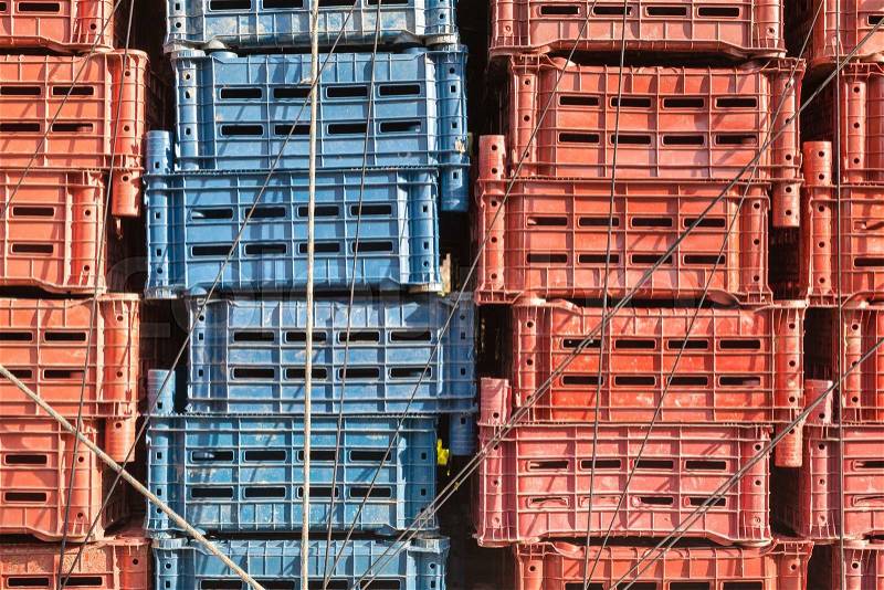 Empty plastic cargo boxes are stacked in a truck, stock photo