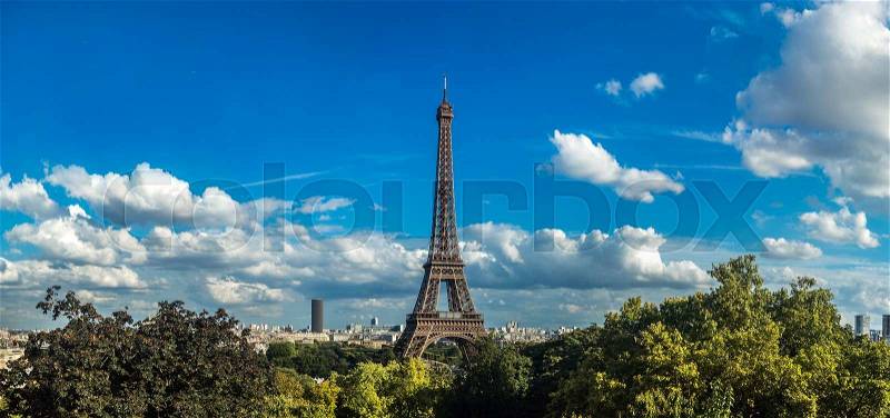 Panorama of the Eiffel Tower in Paris, France in a beautiful summer day, stock photo