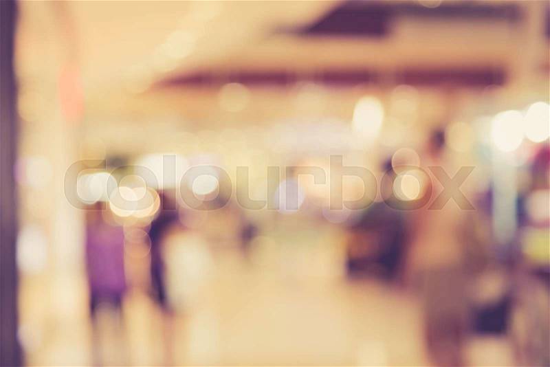 Blurred image of people in shopping mall with bokeh, vintage color, stock photo