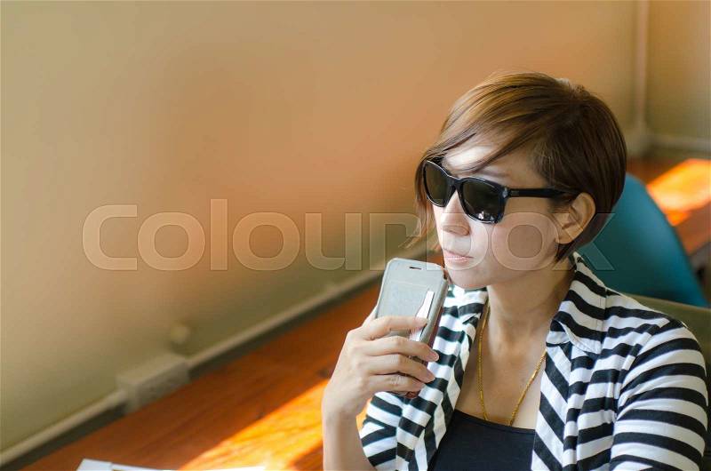 Portrait of smart woman relaxing at cafe, stock photo
