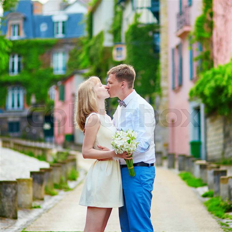Happy just married couple walking on Montmarte in Paris , stock photo
