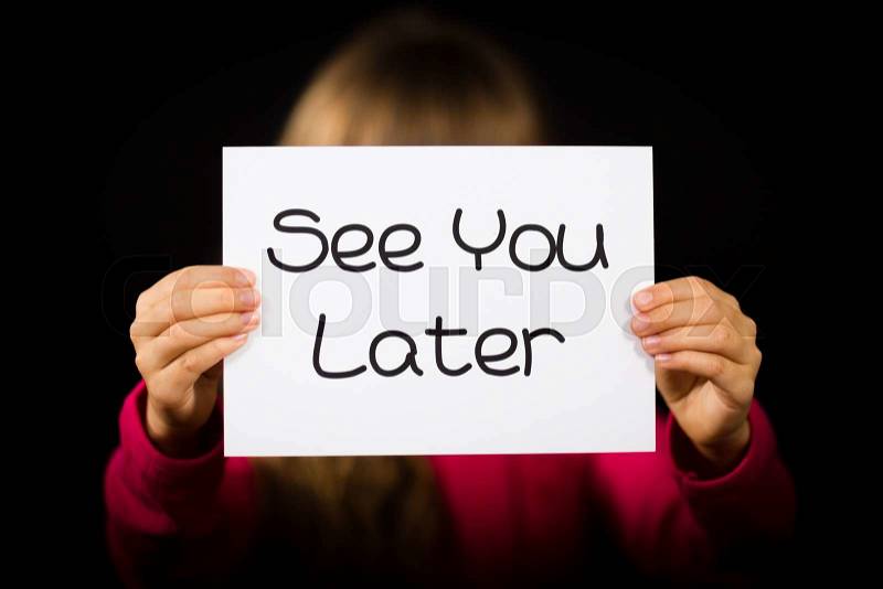 Studio shot of child holding a See You Later sign made of white paper with handwriting, stock photo