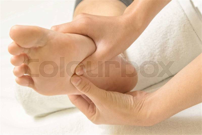 Reflexology foot massage, stock photo