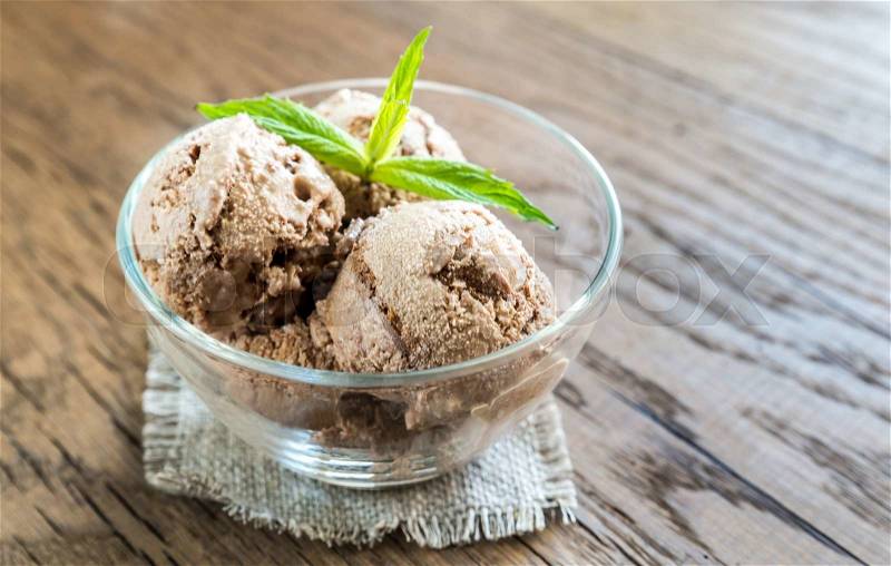 Chocolate ice cream with dessert topping, stock photo