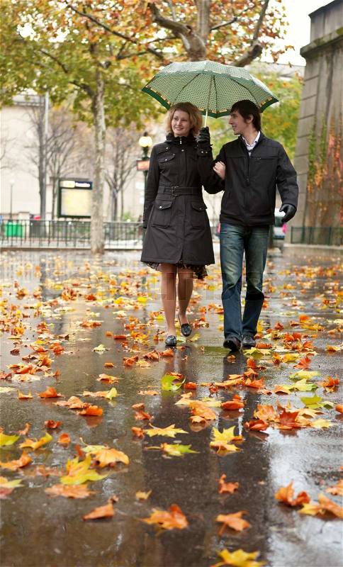 Dating couple in Paris at rain, stock photo