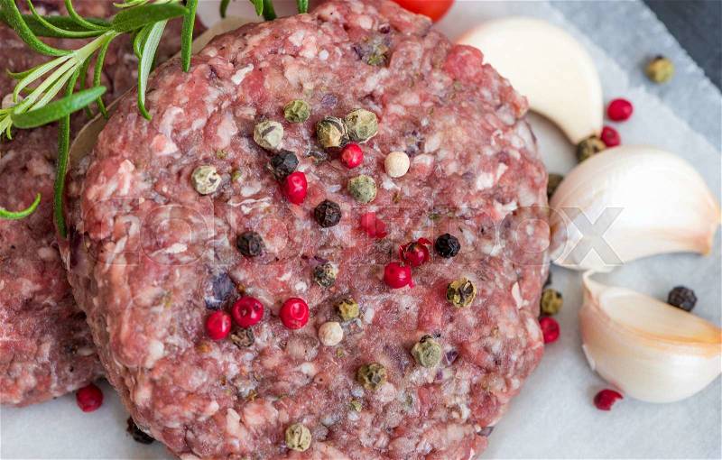 Raw Minced Hamburger Meat with Herb, Spice and Garlic Prepared for Grilling, stock photo