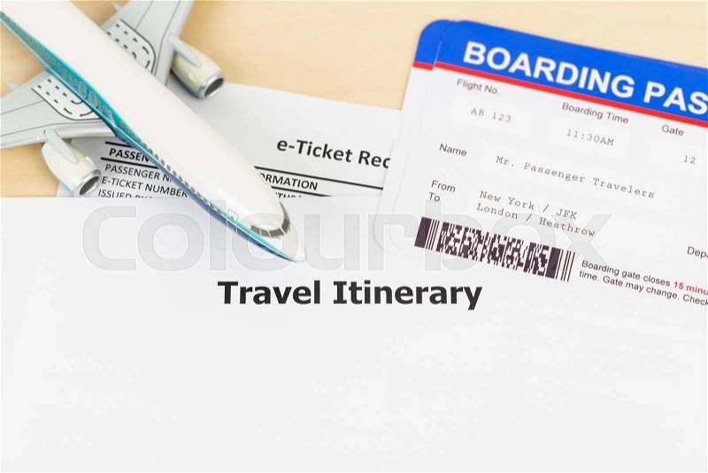 Travel itinerary with copy space, plane model, and boarding pass, stock photo