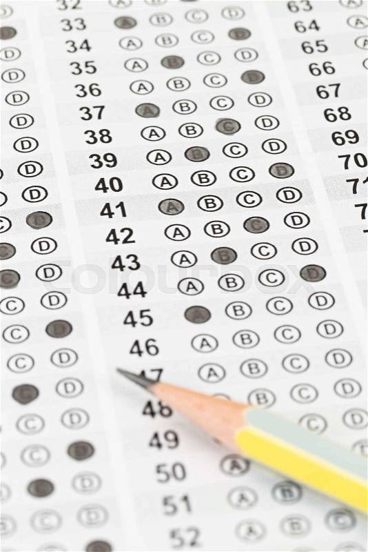 Filled answer sheet focus on pencil, stock photo