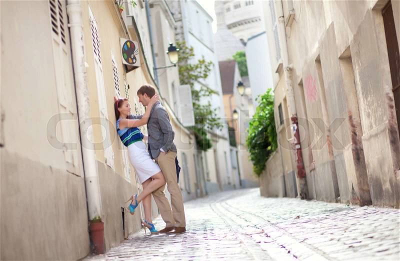 Sensual couple on a street of Montmartre in Paris, stock photo