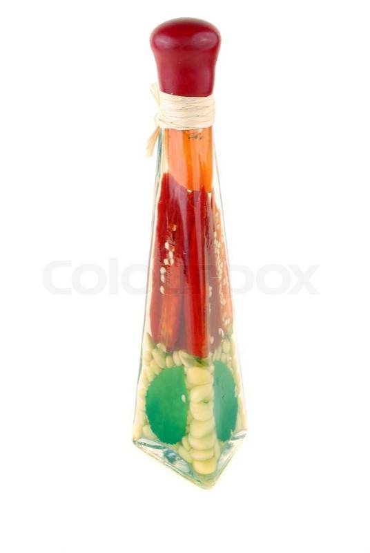 Bottle with spices and vegetables filled in in marinade, stock photo