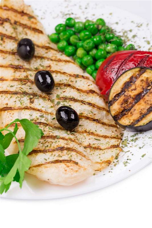 Grilled fish fillet with tasty vegetables. Whole background, stock photo
