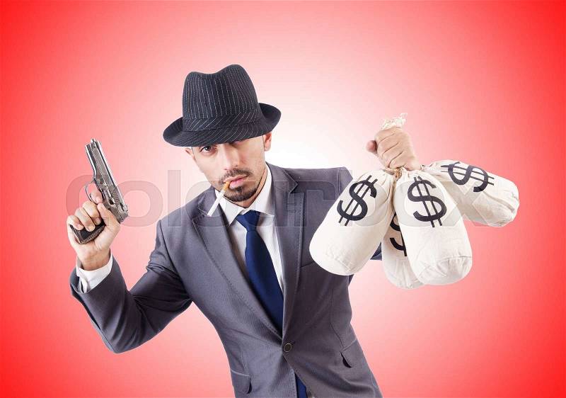 Businessman criminal with sacks of money, stock photo