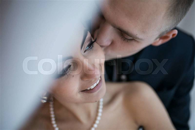 Beautiful European bridal couple in the hotel room, stock photo