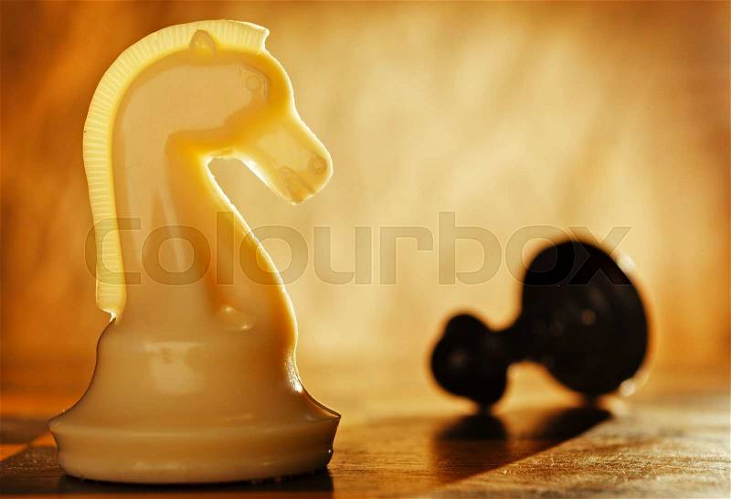 Chess knight pawn in front and in the background. The idea of winning and strategies, stock photo