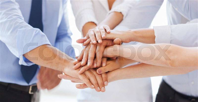 Success and winning concept - happy business team celebrating victory in office, stock photo