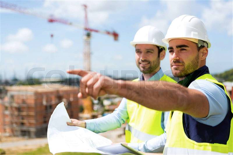View of a Worker and architect watching some details on a construction, stock photo