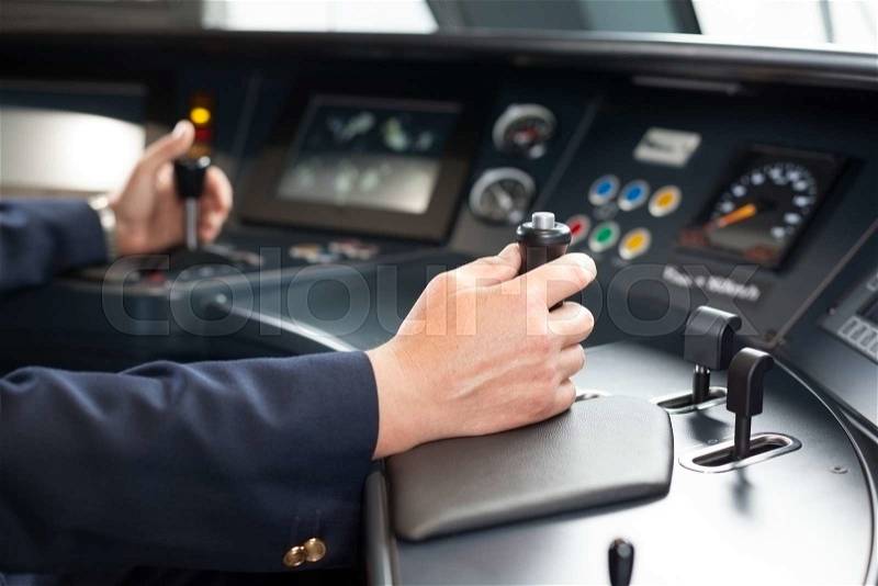 Railroad engineer. Train driver at the workplace, stock photo