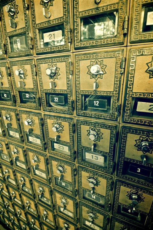 Mailboxes lined up in a post office, stock photo
