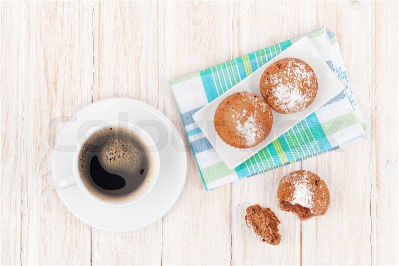 Homemade cakes and coffee cup on white wooden table. Top view, stock photo