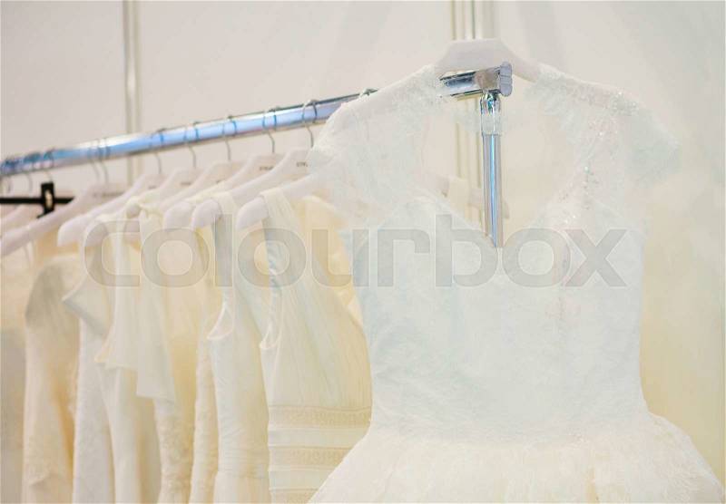 Collection of wedding dresses in the shop, stock photo