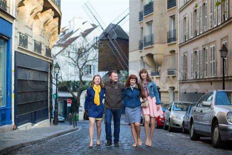 Four friends in Paris together, having fun, stock photo