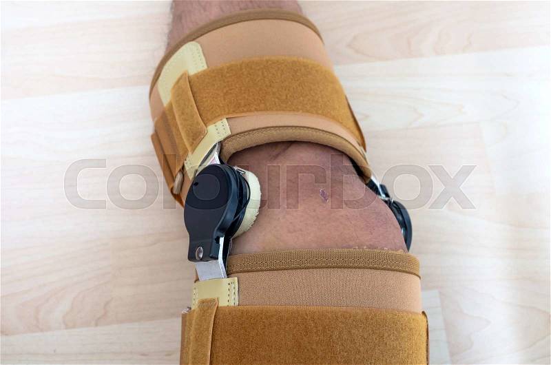 Close up knee brace support for leg or knee injury, stock photo