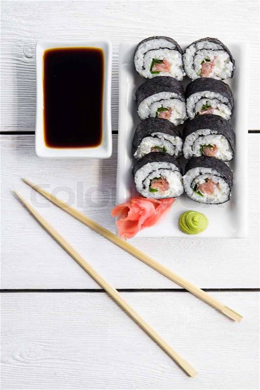 Sushi and roll with cream cheese and salmon fish inside. Top view, stock photo