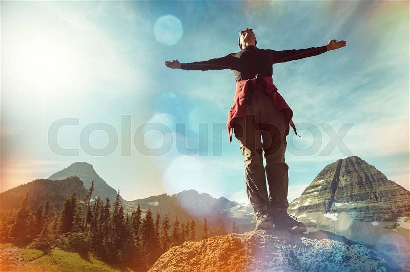 Happy man in mountains, stock photo