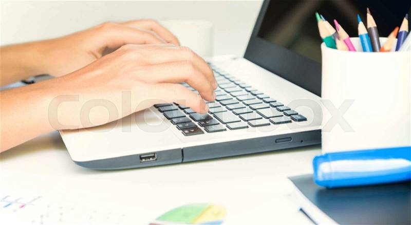 Closeup hand typing on keyboard laptop business work, stock photo