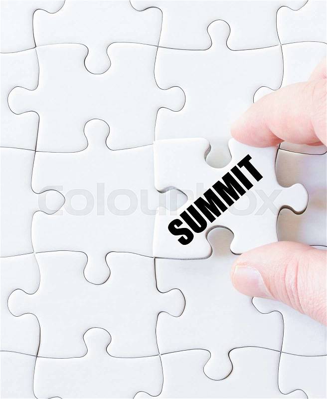 Last puzzle piece with word SUMMIT. Concept image, stock photo