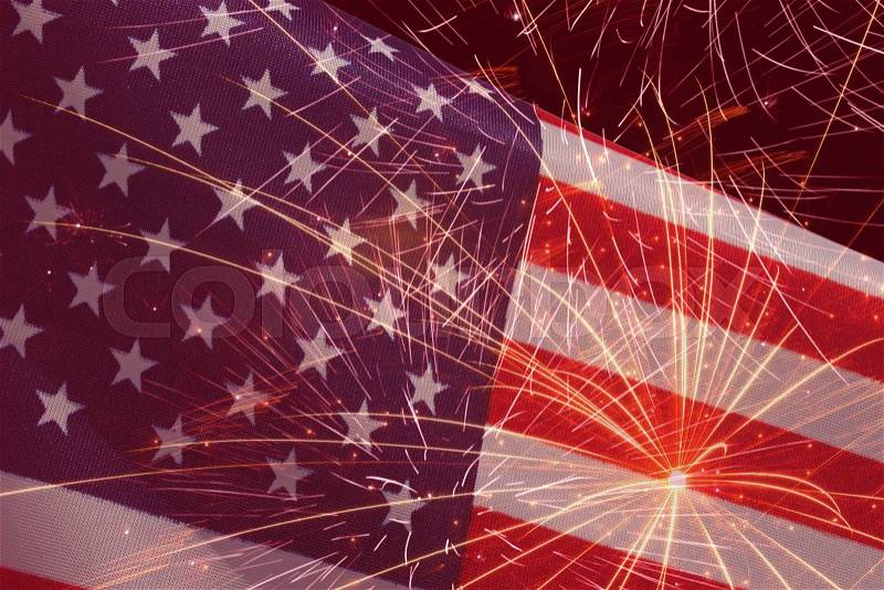 Holiday background with fireworks over United States flag, stock photo