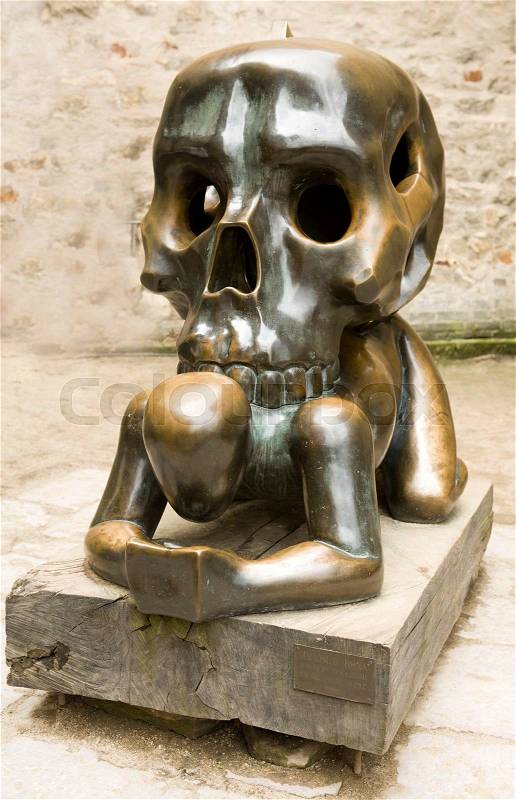 Sculpture of man with skull on his back. The famous Golden Lane in Prague, Czech Republic, stock photo