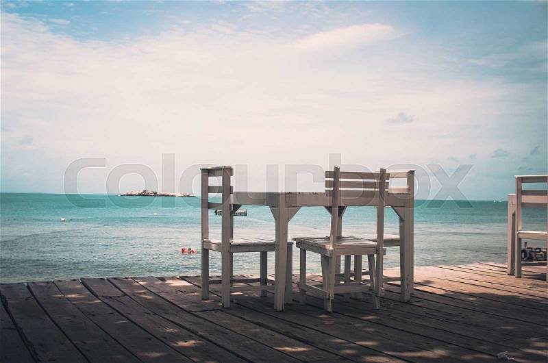 Wood dock White chair and table in Koh Samet Thailand vintage, stock photo