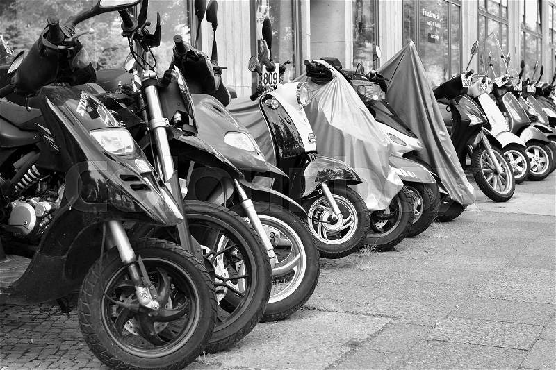 Scooters on the roadside in Berlin, stock photo