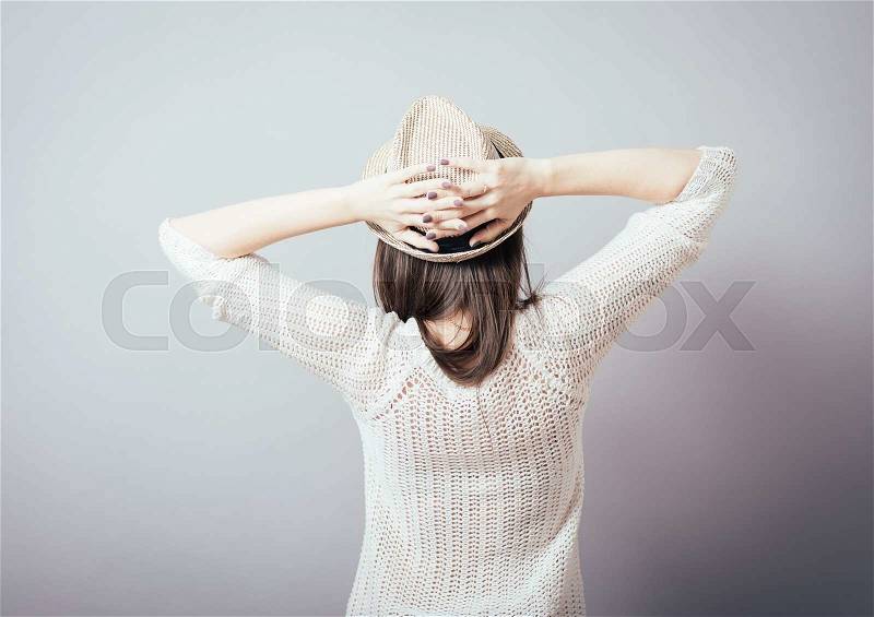 Hipster girl in the hat rear view, stock photo