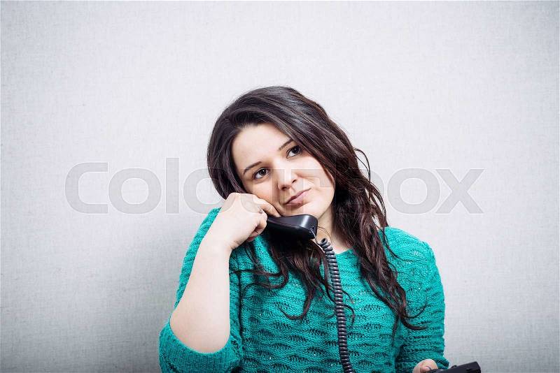 Girl from fixed phones, stock photo