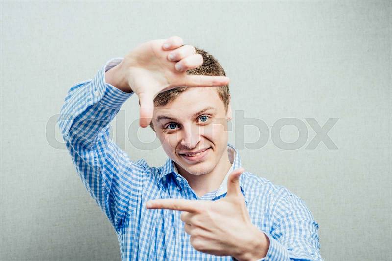 Man making frame hand, stock photo