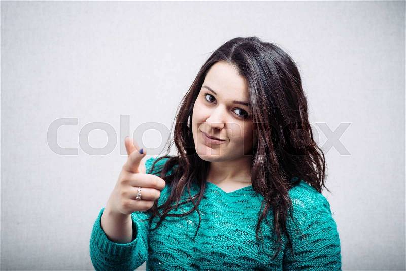Young happy businesswoman pointing at you. , stock photo