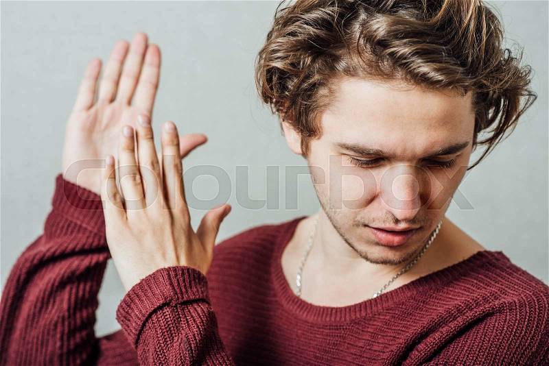 Man claps, applauds, rejoice, happiness, hello, attracts, stock photo