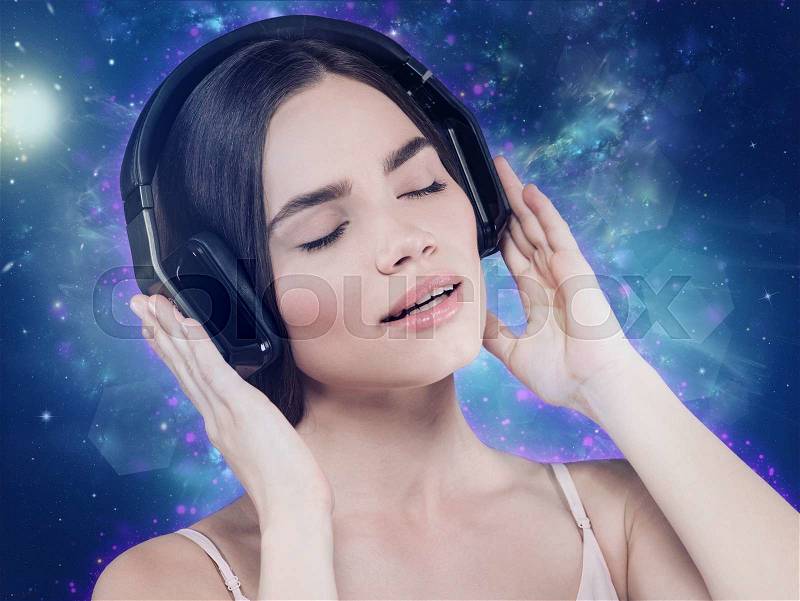 Beauty young girl hearing music with headset, female portrait, stock photo