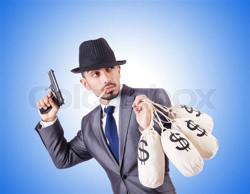 Businessman criminal with sacks of money, stock photo