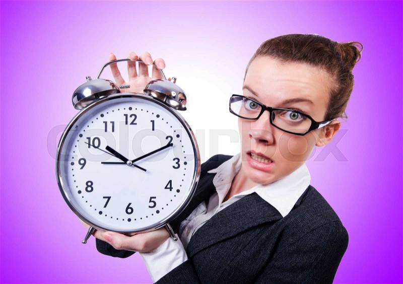Funny woman with clock against the gradient, stock photo