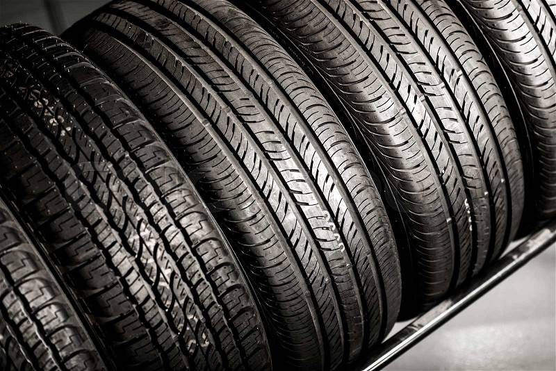 New Compact Vehicles Tires Stack. Winter and Summer Season Tires, stock photo