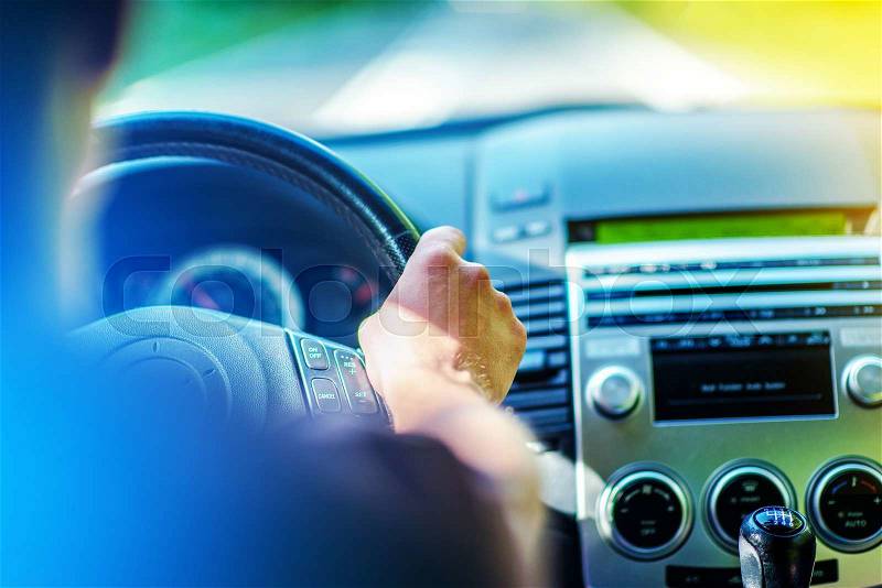 Summer Trip by Car. Driving Theme. Men Driving Car. Hand on Steering Wheel Closeup, stock photo