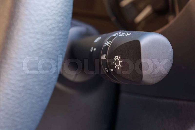 Close up car interior detail with lighting switch, stock photo